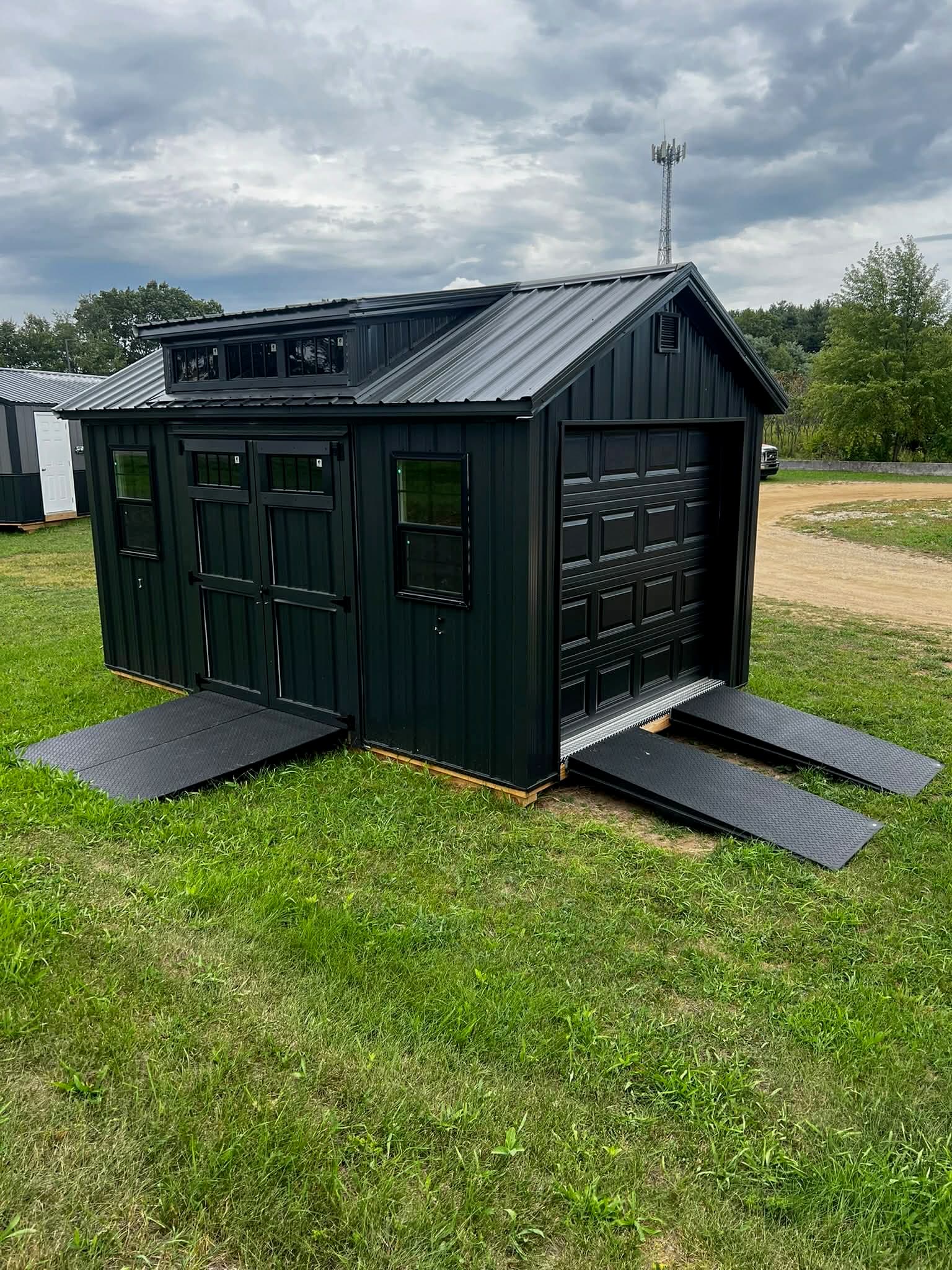 All-black Blackout Package portable building by Avery B&B — available at Miller's Marketplace
